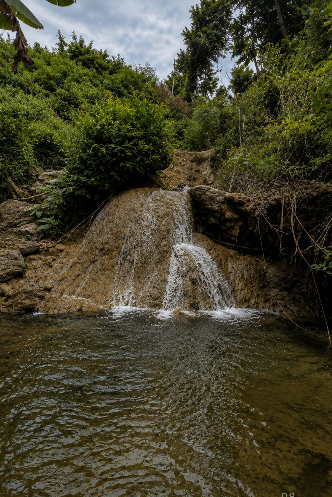 A hidden seasonal waterfall on the Konekt Plots land near Kuta, South Lombok